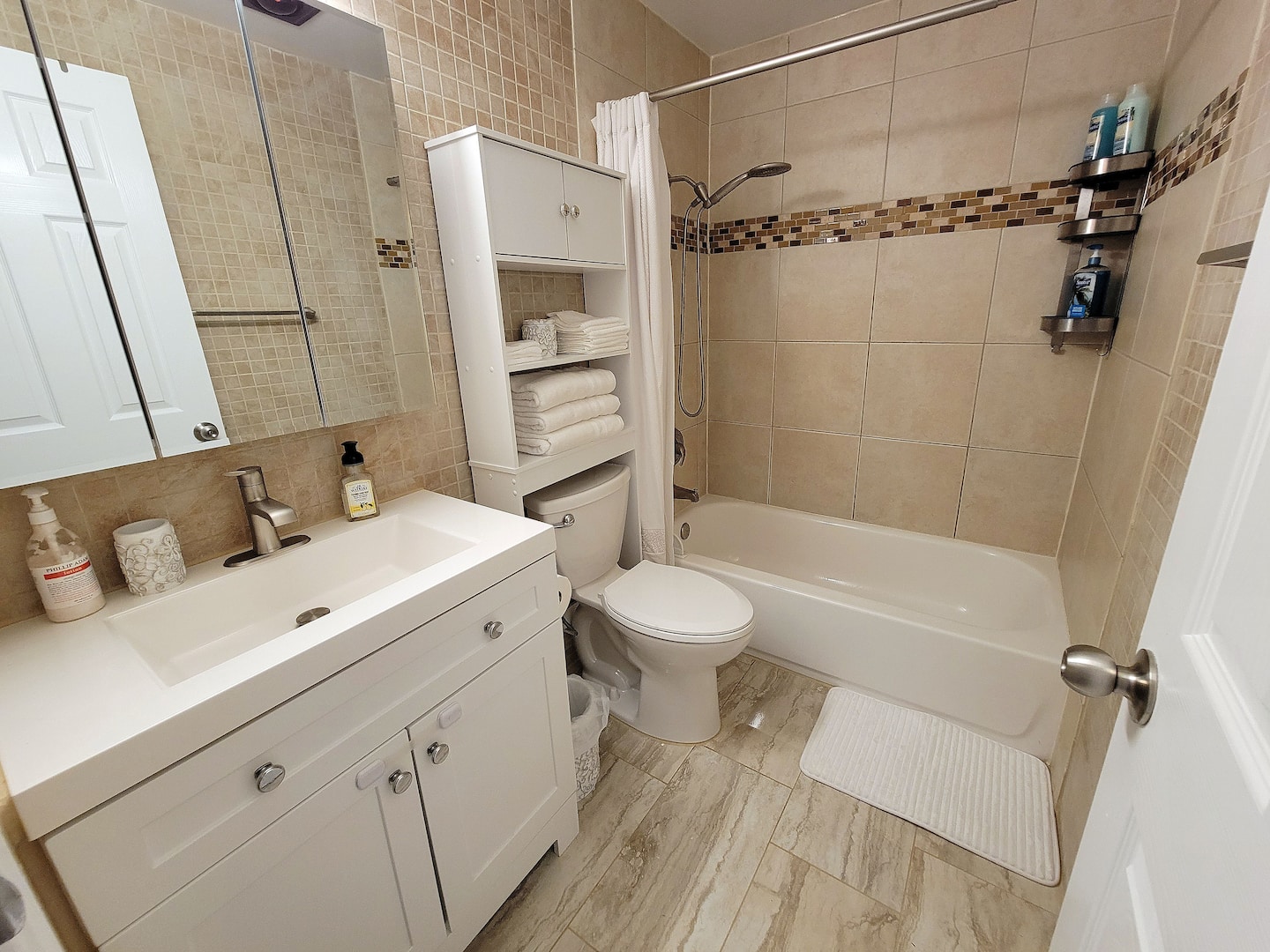 Indulge in the opulent tiled bathroom – a lavish retreat that promises a touch of elegance and pampering.